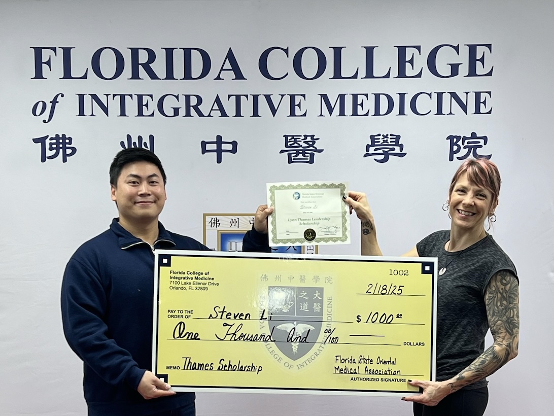 Steven Li on left accepting Thames scholarship from Lisa Lapwing AP